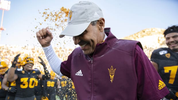 Dec 31, 2019; El Paso, Texas, USA; Arizona State Sun Devils head coach Herm Edwards is doused by Frosted Flakes by his players moments after defeating the Florida State Seminoles 20-14 in the Sun Bowl.